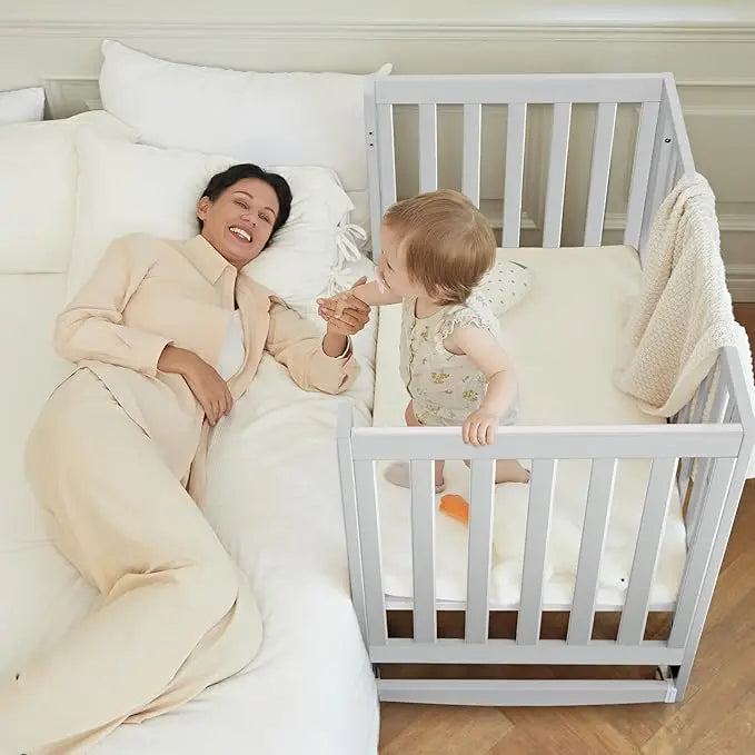 11-In-1 Convertible Mini Cradle to Full Size Crib Removable Wheels 4 Adjustable Heights (WHITE)